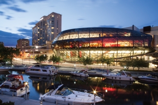 City waterfront at night in Ottawa Ontario Canada with boats docked in the harbour